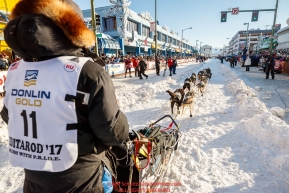 Ketil Reitan runs down the start chute during the Ceremonial Start of the 2017 Iditarod in Anchorage on Saturday March 4, 2017 Photo by Jeff Schultz/SchultzPhoto.com  (C) 2017  ALL RIGHTS RESVERVED