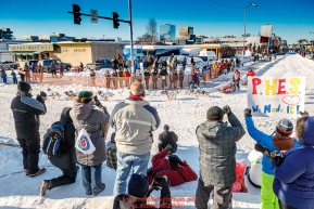 Aliy Zirkle rounds the turn at 4th Avenue and Cordova Street as spectators watch during the Ceremonial Start of the 2017 Iditarod in Anchorage on Saturday March 4, 2017 Photo by Jeff Schultz/SchultzPhoto.com  (C) 2017  ALL RIGHTS RESVERVED