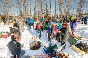 A group calling themselves the IditaRX gang roasts hot dogs for a picnic along the bike/ski trail during the Ceremonial Start of the 2017 Iditarod in Anchorage on Saturday March 4, 2017 Photo by Jeff Schultz/SchultzPhoto.com  (C) 2017  ALL RIGHTS RESVERVED