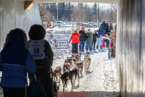 Ken Anderson's team runs through a tunnel on the bike/ski trail during the Ceremonial Start of the 2017 Iditarod in Anchorage on Saturday March 4, 2017 Photo by Jeff Schultz/SchultzPhoto.com  (C) 2017  ALL RIGHTS RESVERVED