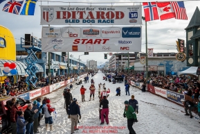 Lisbet Norris leaves the 4th avenue start line amongst the crowds during  the Ceremonial Start of the 2016 Iditarod in Anchorage, Alaska.  March 05, 2016