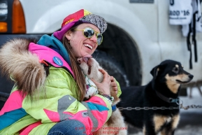 Monica Zappa poses with a dog just prior to the Ceremonial Start of the 2016 Iditarod in Anchorage, Alaska.  March 05, 2016