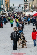 Ketil Reitan leads a procession of mushers as they walk their dogs down 4th avenue to the start line during the Ceremonial Start of the 2016 Iditarod in Anchorage, Alaska.  March 05, 2016