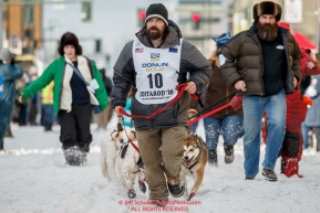 Musher Cim Smyth leads his dogs to the start line on 4th avenue during the Ceremonial Start of the 2016 Iditarod in Anchorage, Alaska.  March 05, 2016