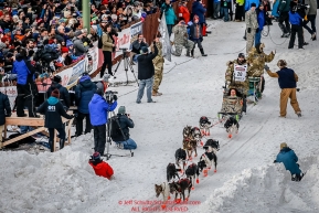 Rick Casillo runs down 4th avenue after leaving the start line in downtown during the Ceremonial Start of the 2016 Iditarod in Anchorage, Alaska.  March 05, 2016