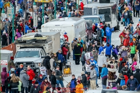 Dog teams stage in a line up down 4th avenue as they get ready to leave the start line during the Ceremonial Start of the 2016 Iditarod in Anchorage, Alaska.  March 05, 2016