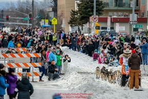 Spectators line Cordova Street as Kim Franklin passes during the Ceremonial Start of the 2016 Iditarod in Anchorage, Alaska.  March 05, 2016