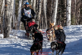 Anna Bertington runs down the trail after leaving the start during the Restart of the 2016 Iditarod in Willow, Alaska.  March 06, 2016.