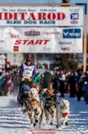 Ryne Olson runs down the start chute durnig the Re-Start of the 2016 Iditarod in Willow, Alaska.  March 06, 2016