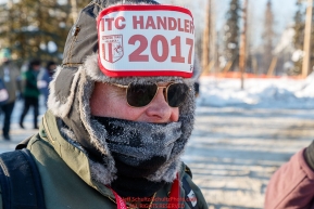 Volunteer Ron Bass walks around in the staging area prior to the re-start of the 2017 Iditarod in Fairbanks, Alaska at PikeÂs Landing on Monday March 6, 2017.Photo by Jeff Schultz/SchultzPhoto.com  (C) 2017  ALL RIGHTS RESVERVED