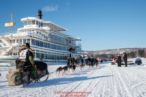 Rick Casillo runs down the Chena River and past the Riverboat Discovery and spectators during the re-start of the 2017 Iditarod in Fairbanks, Alaska at PikeÂs Landing on Monday March 6, 2017.Photo by Jeff Schultz/SchultzPhoto.com  (C) 2017  ALL RIGHTS RESVERVED
