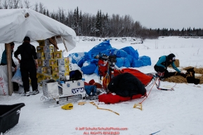A team arrives at Nikolai on the river as volunteers work in the checkpoint at the Nikolai checkpoint during the 2018 Iditarod race on Tuesday afternoon March 06, 2018. Photo by Jeff Schultz/SchultzPhoto.com  (C) 2018  ALL RIGHTS RESERVED