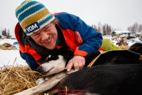 Lars Monsen massages the wrist of his dog