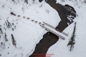 Allen Moore crosses a bridge over Solomon Creek between Rohn and Nikolai during the 2018 Iditarod race on Tuesday afternoon March 06, 2018. Photo by Jeff Schultz/SchultzPhoto.com  (C) 2018  ALL RIGHTS RESERVED