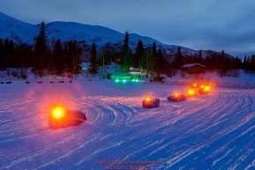 Runway lights are used to point the right direction of the outgoing trail in the morning at the Finger Lake checkpoint at Winterlake Lodge during Iditarod 2016.  Alaska.  March 07, 2016.  Photo by Jeff Schultz (C) 2016 ALL RIGHTS RESERVED