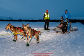 A Jason Mackey dog is still eager to run after arriving in the morning at the Finger Lake checkpoint at Winterlake Lodge during Iditarod 2016.  Alaska.  March 07, 2016.  Photo by Jeff Schultz (C) 2016 ALL RIGHTS RESERVED