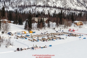 A team checks in as others rest on the lake at the Finger Lake  checkpoint during Iditarod 2016.  Alaska.  March 07, 2016.  Photo by Jeff Schultz (C) 2016 ALL RIGHTS RESERVED