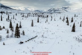 Brent Sass on the trail in the Alaska Range in Ptarmigan Valley on the way to Rohn from the Rainy Pass checkpoint during Iditarod 2016.  Alaska.  March 07, 2016.  Photo by Jeff Schultz (C) 2016 ALL RIGHTS RESERVED