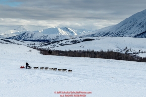 John Baker on the trail in the Alaska Range in Ptarmigan Valley on the way to Rohn from the Rainy Pass checkpoint during Iditarod 2016.  Alaska.  March 07, 2016.  Photo by Jeff Schultz (C) 2016 ALL RIGHTS RESERVED