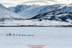 Kelly Maixner on the trail in the Alaska Range in Ptarmigan Valley on the way to Rohn from the Rainy Pass checkpoint during Iditarod 2016.  Alaska.  March 07, 2016.  Photo by Jeff Schultz (C) 2016 ALL RIGHTS RESERVED