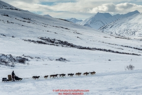 Richie Diehl on the trail in the Alaska Range in Ptarmigan Valley on the way to Rohn from the Rainy Pass checkpoint during Iditarod 2016.  Alaska.  March 07, 2016.  Photo by Jeff Schultz (C) 2016 ALL RIGHTS RESERVED