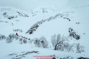 Ralph Johannessen on the trail in the Alaska Range in Ptarmigan Valley on the way to Rohn from the Rainy Pass checkpoint during Iditarod 2016.  Alaska.  March 07, 2016.  Photo by Jeff Schultz (C) 2016 ALL RIGHTS RESERVED