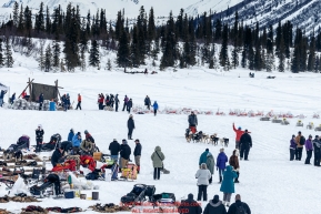 Justin Savidis is guided to a parking spot on Puntilla Lake at the Rainy Pass Checkpoint during Iditarod 2016.  Alaska.  March 07, 2016.  Photo by Jeff Schultz (C) 2016 ALL RIGHTS RESERVED