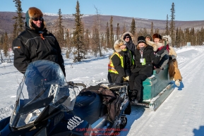 Volunteers get a ride from the community hall to the at the checkpoint in Manley Hot Springs during the 2017 Iditarod on Tuesday March 7, 2017.Photo by Jeff Schultz/SchultzPhoto.com  (C) 2017  ALL RIGHTS RESVERVED