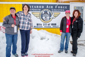 McGrath logistics volunteers, Diana Moroney, Deb Miller, Darcy Harris and Jodie Guest pose for a photo outide their office at the McGrath checkpoint during the 2018 Iditarod race on Wednesday March 07, 2018. Photo by Jeff Schultz/SchultzPhoto.com  (C) 2018  ALL RIGHTS RESERVED