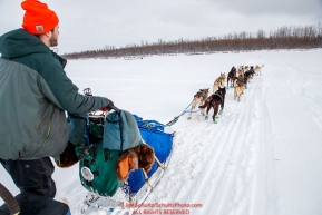 Bradley Farquar runs down the Kuskokwim river in the afternoon at the McGrath checkpoint during the 2018 Iditarod race on Wednesday March 07, 2018. Photo by Jeff Schultz/SchultzPhoto.com  (C) 2018  ALL RIGHTS RESERVED