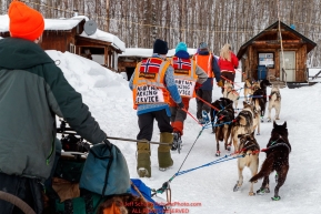 Volunteers from Norway park Bradley Farquar's dogs for a 24-hour layover in the afternoon at the Takotna checkpoint during the 2018 Iditarod race on Wednesday March 07, 2018. Photo by Jeff Schultz/SchultzPhoto.com  (C) 2018  ALL RIGHTS RESERVED