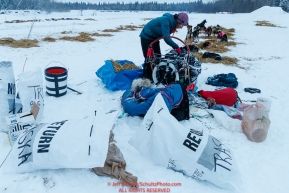 Shaynee Traska packs her sled in the morning at the Nikolai checkpoint during the 2018 Iditarod race on Wednesday March 07, 2018. Photo by Jeff Schultz/SchultzPhoto.com  (C) 2018  ALL RIGHTS RESERVED