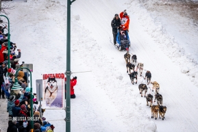 The view from above as a musher races down 4th Avenue at the ceremonial start in Anchorage, AK of the 2020 Iditarod.