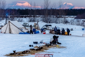 A team rests in front of the volunteer-manned checkpoint at the Nikolai checkpoint during Iditarod 2016.  Alaska.  March 08, 2016.  Photo by Jeff Schultz (C) 2016 ALL RIGHTS RESERVED