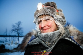 Trail volunteer Laurie Thorpe is frosted up between chores at the Tanana checkpoint during the 2017 Iditarod on Wednesday morning March 8, 2017.Photo by Jeff Schultz/SchultzPhoto.com  (C) 2017  ALL RIGHTS RESERVED