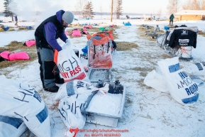 Justin High unpacks his sled at the Tanana checkpoint during the 2017 Iditarod on Wednesday morning March 8, 2017.Photo by Jeff Schultz/SchultzPhoto.com  (C) 2017  ALL RIGHTS RESERVED