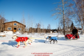 Peter Reuter runs down the road and into the Tanana checkpoint during the 2017 Iditarod on Wednesday afternoon March 8, 2017.Photo by Jeff Schultz/SchultzPhoto.com  (C) 2017  ALL RIGHTS RESERVED