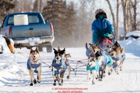 Misha Wiljes runs down the road into the Tanana checkpoint during the 2017 Iditarod on Wednesday afternoon March 8, 2017.Photo by Jeff Schultz/SchultzPhoto.com  (C) 2017  ALL RIGHTS RESERVED