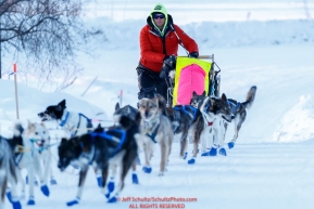 Wade Marrs runs up the hill as he arrives in first place at the Ruby checkpoint during the 2017 Iditarod on Wednesday March 8, 2017.Photo by Jeff Schultz/SchultzPhoto.com  (C) 2017  ALL RIGHTS RESERVED