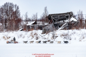 Jeff King runs past a derelict building as he approaches the ghost town of Iditarod on Thursday, March 8th during the 2018 Iditarod Sled Dog Race -- AlaskaPhoto by Jeff Schultz/SchultzPhoto.com  (C) 2018  ALL RIGHTS RESERVED