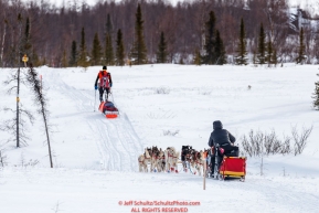 Mitch Seavey passes an Iditasport walker Beat Jegerleheron the trail just prior to the checkpoint at Iditarod on Thursday, March 8th during the 2018 Iditarod Sled Dog Race -- AlaskaPhoto by Jeff Schultz/SchultzPhoto.com  (C) 2018  ALL RIGHTS RESERVED