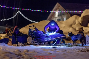 Travis Beals packs his sled by headlamp as he prepares to leave the Takotna checkpoint during his 24-hour layover on Thursday, March 8th during the 2018 Iditarod Sled Dog Race -- AlaskaPhoto by Jeff Schultz/SchultzPhoto.com  (C) 2018  ALL RIGHTS RESERVED