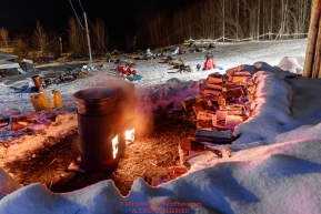 Dog water stays hot in barrels as mushers prepare to leave the Takotna checkpoint after their 24-hour layover on Thursday, March 8th during the 2018 Iditarod Sled Dog Race -- AlaskaPhoto by Jeff Schultz/SchultzPhoto.com  (C) 2018  ALL RIGHTS RESERVED