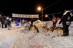 Allen Moore holds his wife's leaders as Aliy Zirkle prepares to leave the Takotna checkpoint after their 24-hour layover on Thursday, March 8th during the 2018 Iditarod Sled Dog Race -- AlaskaPhoto by Jeff Schultz/SchultzPhoto.com  (C) 2018  ALL RIGHTS RESERVED