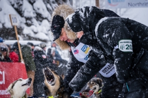 Musher Martin Massicotte of Quebec talking to his dogs prior to the re-start of the 2020 Iditarod in Willow, Alaska.