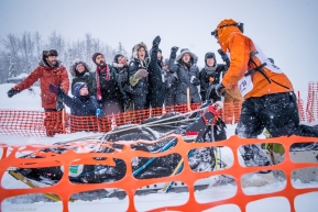 Fans having fun and cheering on a passing musher at the re-start of the 2020 Iditarod in Willow, Alaska.