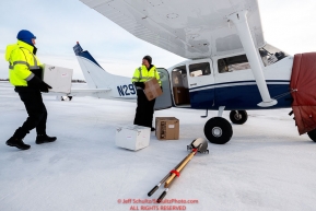 Chief pilot Russ Dunlap (Left) helps volunteer pilot Mike Swalling load his Cessna 206 with supplies headed to Nulato at the Galena airport during the 2017 Iditarod on Thursday afternoon March 9, 2017.Photo by Jeff Schultz/SchultzPhoto.com  (C) 2017  ALL RIGHTS RESERVED