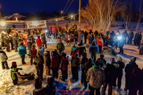 Mitch Seavey is surrounded by villagers as he arrived in first place and wins the GCI Dorothy G. Page Halfway award at the Huslia checkpoint during the 2017 Iditarod on Thursday night  March 9, 2017.Photo by Jeff Schultz/SchultzPhoto.com  (C) 2017  ALL RIGHTS RESERVED