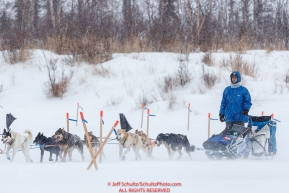 Noah Pereira on the trail heading into the Iditarod checkpoint as the wind blows snow on Friday, March 9th during the 2018 Iditarod Sled Dog Race -- AlaskaPhoto by Jeff Schultz/SchultzPhoto.com  (C) 2018  ALL RIGHTS RESERVED