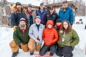 Volunteer checkers, helpers and comms pose for a group photo at the Iditarod checkpoint on Friday, March 9th during the 2018 Iditarod Sled Dog Race -- AlaskaPhoto by Jeff Schultz/SchultzPhoto.com  (C) 2018  ALL RIGHTS RESERVED